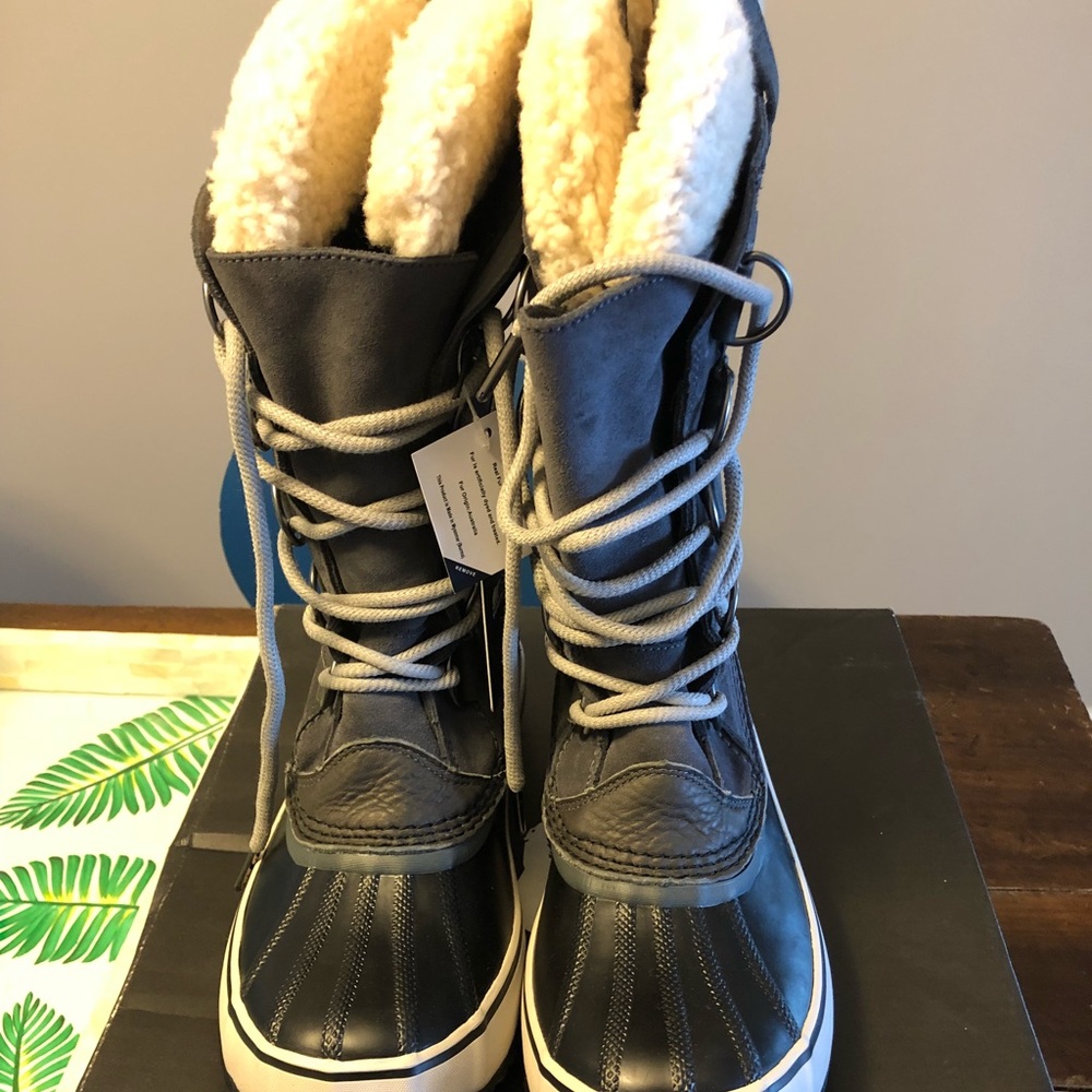 Sorel “Joan of arctic shearling” winter boots
